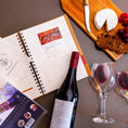 Cargar la imagen en la vista de la galería, Treasured Wine Journal - With label removed with wine label removers
Bottle with label removed from it, wine journals with Leeuwin Estate Shiraz wine label affixed to page and 100 pack of wine label removers in foreground

