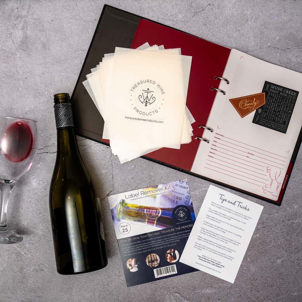 Open wine journal with wine bottle wine glass and wine label remover kit